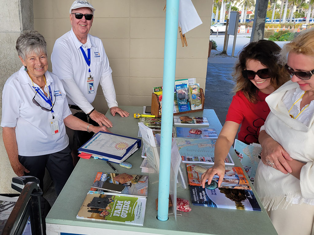 Image of beach ambassadors helping citizens.