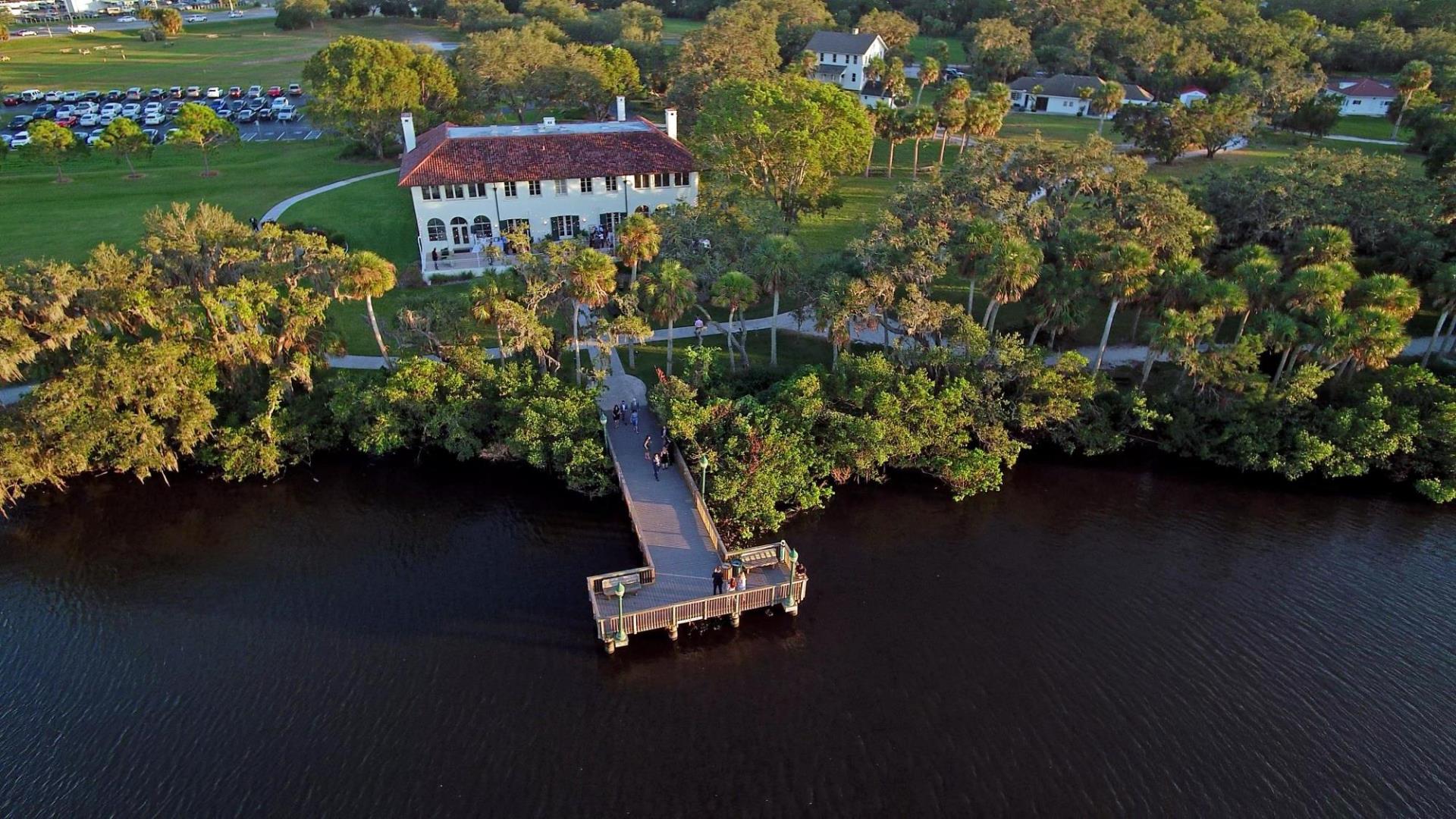 Aerial wedding photo of a wedding at the Phillippi Estate Park mansion, view from the back of the mansion